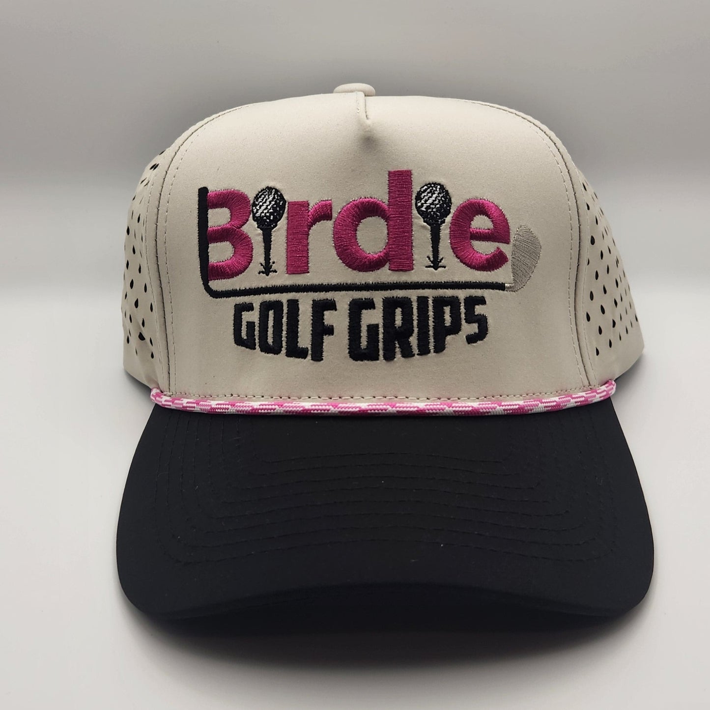 Tan and black hat with Pink logo