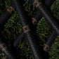Birdie Golf Grips Smoke & Barrel black golf club grips with raised diamond texture and gold detailing on green grass.